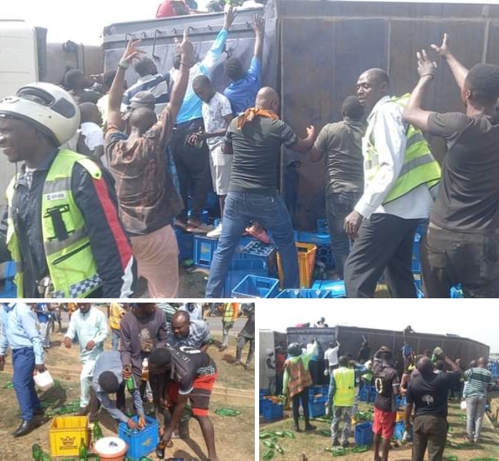 Drama As Abuja Residents Storm Accident Scene With Buckets, Others For Free Beer As Loaded Truck Falls Over